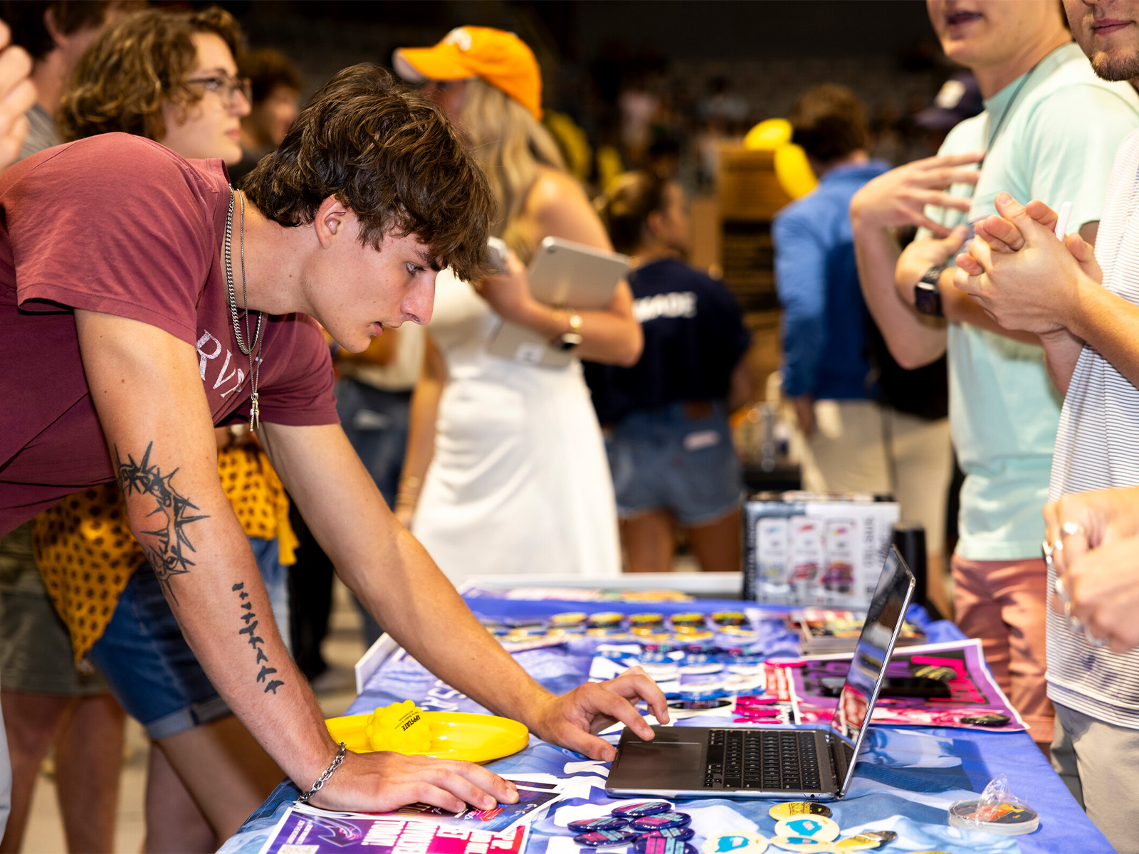 A student using a laptop to sign up for a club