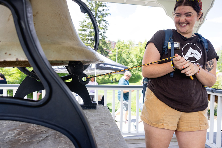 A student ringing the Founder's Bell