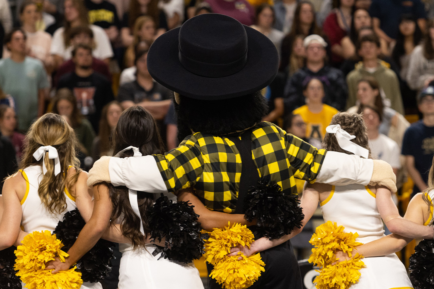 Yosef with cheerleaders